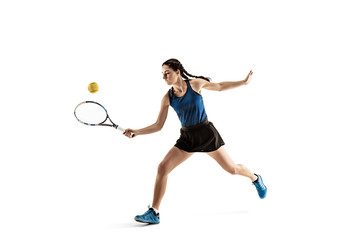 Fototapeta na wymiar Full length portrait of young woman playing tennis isolated on white background. Healthy lifestyle. The practicing, fitness, sport, exercise concept. The female model in motion or movement