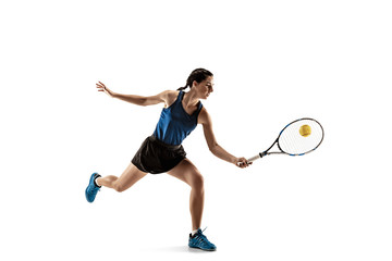 Full length portrait of young woman playing tennis isolated on white background. Healthy lifestyle....