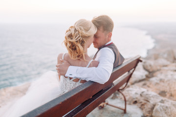 Wedding in the mountains at sunset on the beach of Cyprus. The happy couple and a beautiful view.