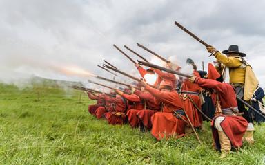 Soldiers of the 17th century in one gulp shoot rifles