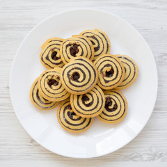 Freshly baked cookies on a white plate, overhead view. Flat lay, top view.
