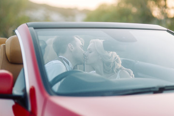 The couple traveling by car on Cyprus. Beautiful scenery at sunset.
