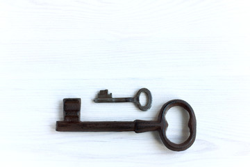 small and large. two old keys of different size