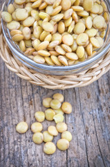 Raw lentils on wooden table with copy space