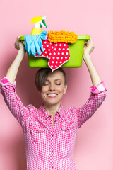 Woman with house supplies ready to to clean room. Spring cleaning 