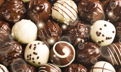 Dark, milk and white chocolate candies / pralines / truffles