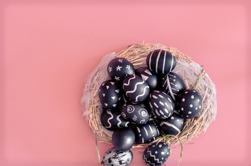 Easter composition with eggs on a pink background
