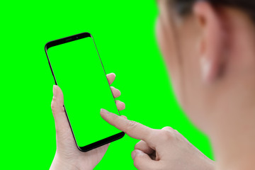 Obraz na płótnie Canvas Woman touch isolated smart phone screen. App presentation mockup. Isolated in green, chroma key.