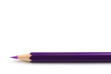 Wooden violet pencil isolated on a white background, close ap.