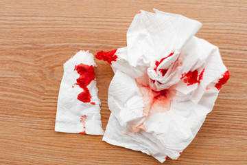 bloody tissue on the floor