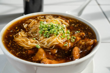 Maki Mi or pork tenderloin egg noodle in thick brown broth