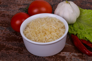 Raw uncooked rice in the bowl