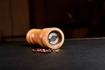 pepper with sweet pepper on a wooden background