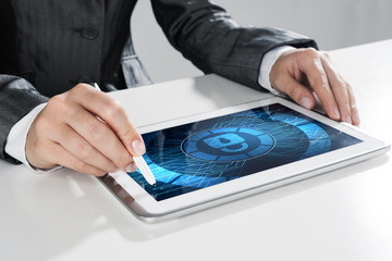 Internet security concept with woman working on media screen with stylus