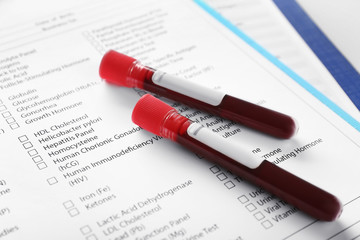 Blood samples on document with result of analyses