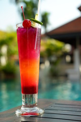 butterfly pea punch mocktail at poolside bar