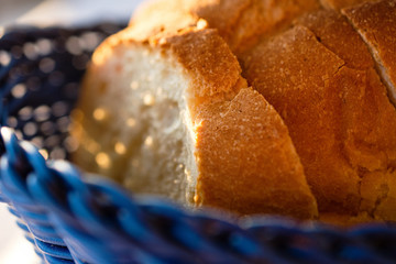 Tasty Loaves Of Traditional Homemade Bread In Blue Wooden Basket