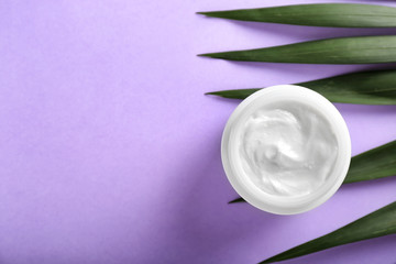Jar of cream on color background