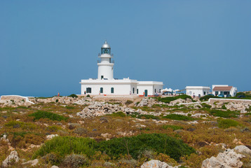 Fototapeta na wymiar Cavalleria lighthouse off in Menorca island