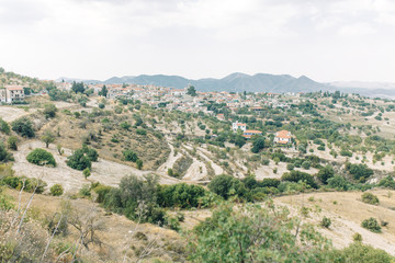 Fototapeta na wymiar Beautiful Cypriot landscapes in summer. City streets and mountains in nature.