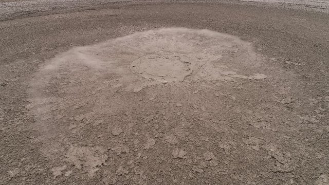Mud volcano with bursting bubble bledug kuwu. aerial view volcanic plateau with geothermal activity and geysers, Indonesia java. aerial view volcanic landscape