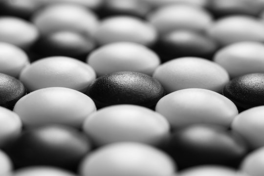 Background of black and white stones Go game. Close-up