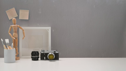 Office minimalist desk with vintage camera, stuff and copy space