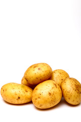 Raw potatoes isolated on a white background with copy space
