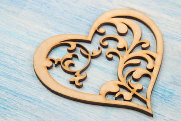 wooden heart on a blue wooden background. close-up. Valentine's Day.