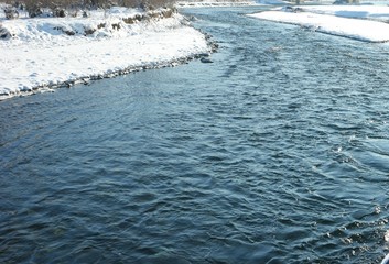 White snow and blue river, background