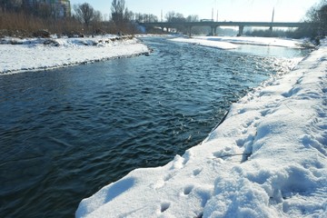 Panorama of the riverbed of a mountain river on a sunny winter day