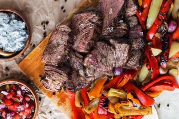 meat meal served on the wooden plate