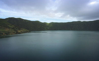 Aerial View from a beautiful lagoon surrounded by mountains. Ancient volcano crater. Seven Cities lagoon Azores Islands Portugal