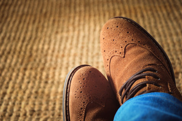 Top view from man with brown leather shoes and jeans
