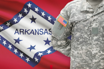 American soldier with US state flag on background - Arkansas