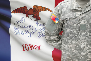 American soldier with US state flag on background - Iowa