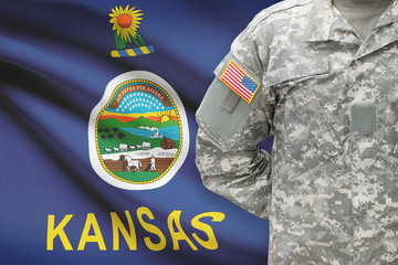 American soldier with US state flag on background - Kansas