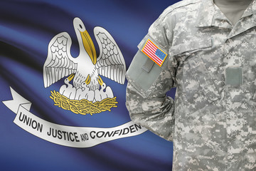 American soldier with US state flag on background - Louisiana