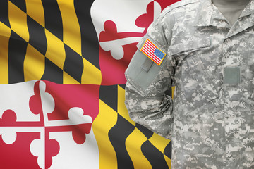 American soldier with US state flag on background - Maryland