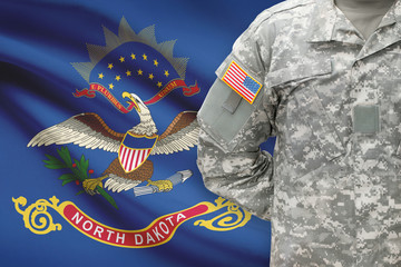 American soldier with US state flag on background - North Dakota