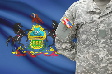 American soldier with US state flag on background - Pennsylvania