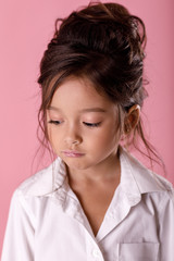 offended sad bored little girl in white shirt
