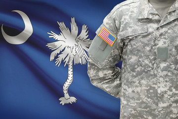 American soldier with US state flag on background - South Carolina