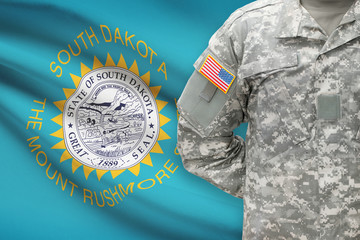American soldier with US state flag on background - South Dakota