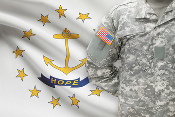American soldier with US state flag on background - Rhode Island