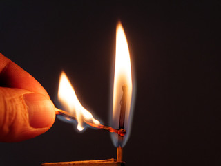 matches sulfur burn with a red flame on a dark background