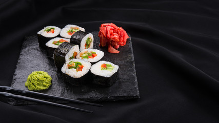 Sushi roll with wasabi and ginger