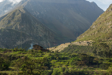 house and ruins in the mountains