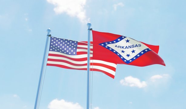 USA and state Arkansas, two flags waving against blue sky. 3d image