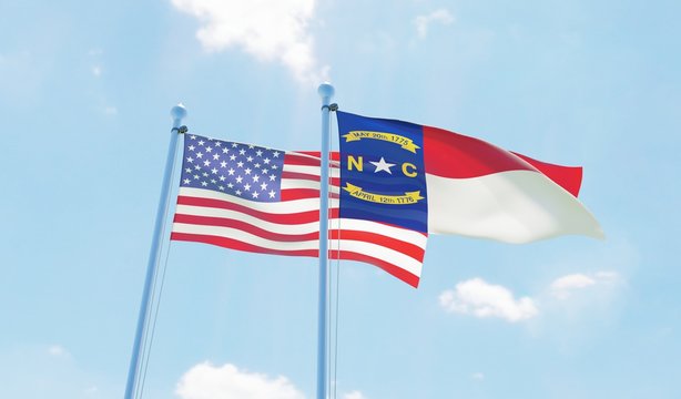 USA and state North Carolina, two flags waving against blue sky. 3d image